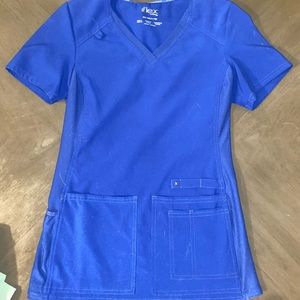 Cherokee Iflex Women's V-Neck Solid Knit Panel Scrub Top in color Galaxy Blue